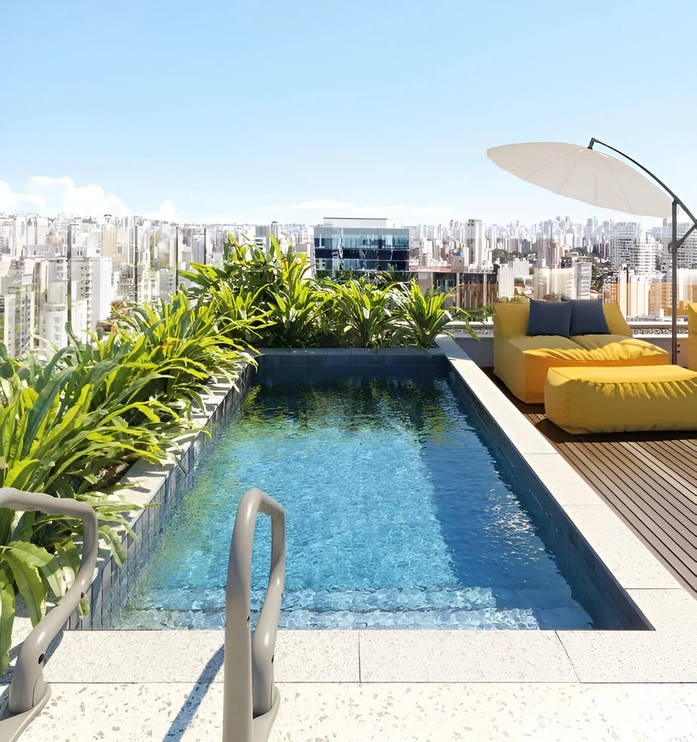 Rooftop terrace swimming pool featuring yellow lounge seating, an umbrella, planters, and a city skyline background