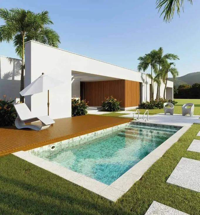 Modern luxury backyard swimming pool featuring a wooden deck, lounge chair, white umbrella, and palm trees