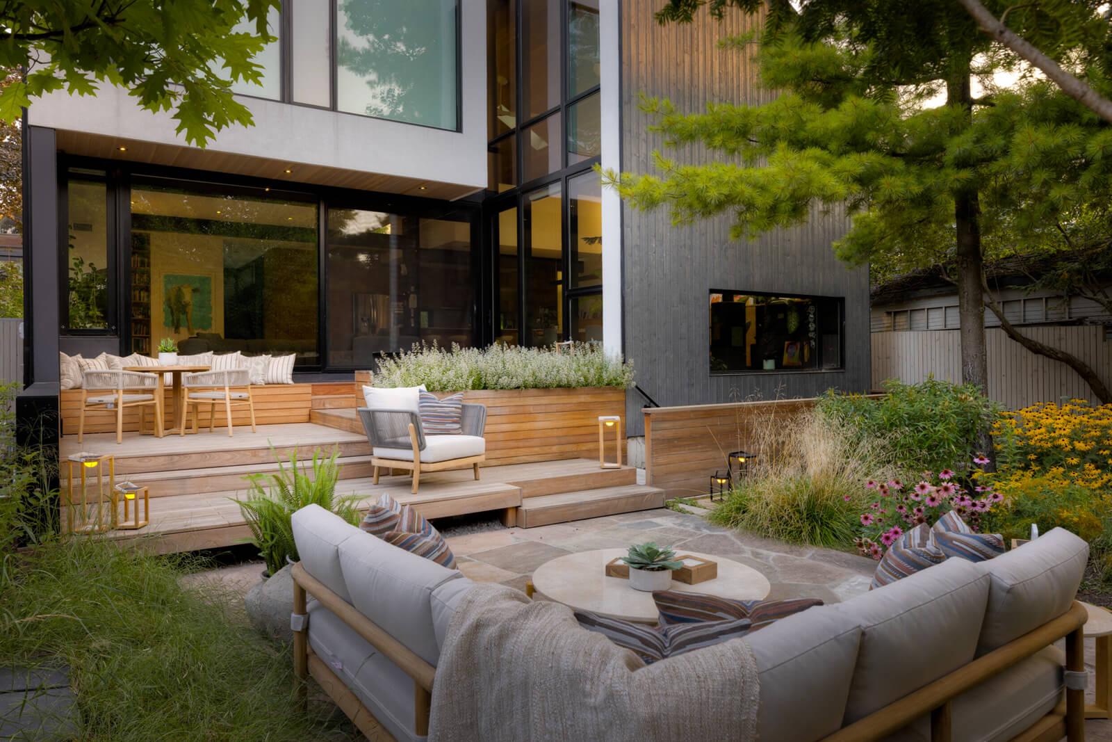 Modern backyard featuring a timber deck and stone patio for outdoor living