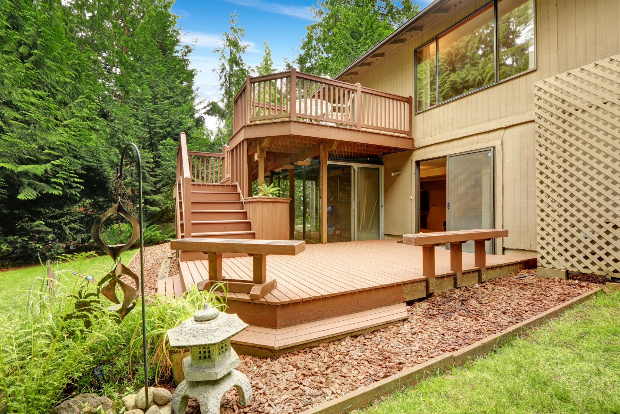 Multi-level wooden deck creating depth and defined outdoor living zones