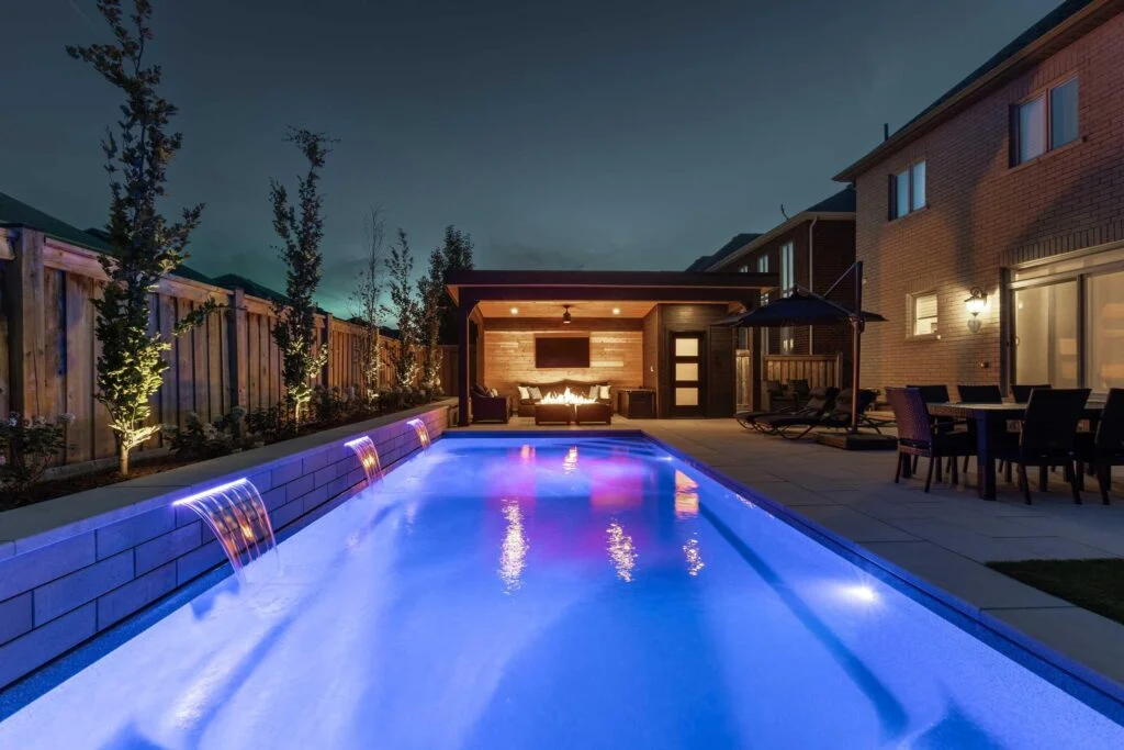 Fiberglass backyard pool with integrated lighting for evening use